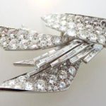 Sterle Platinum Round And Baguette Diamond Pin. Sold For $36,250